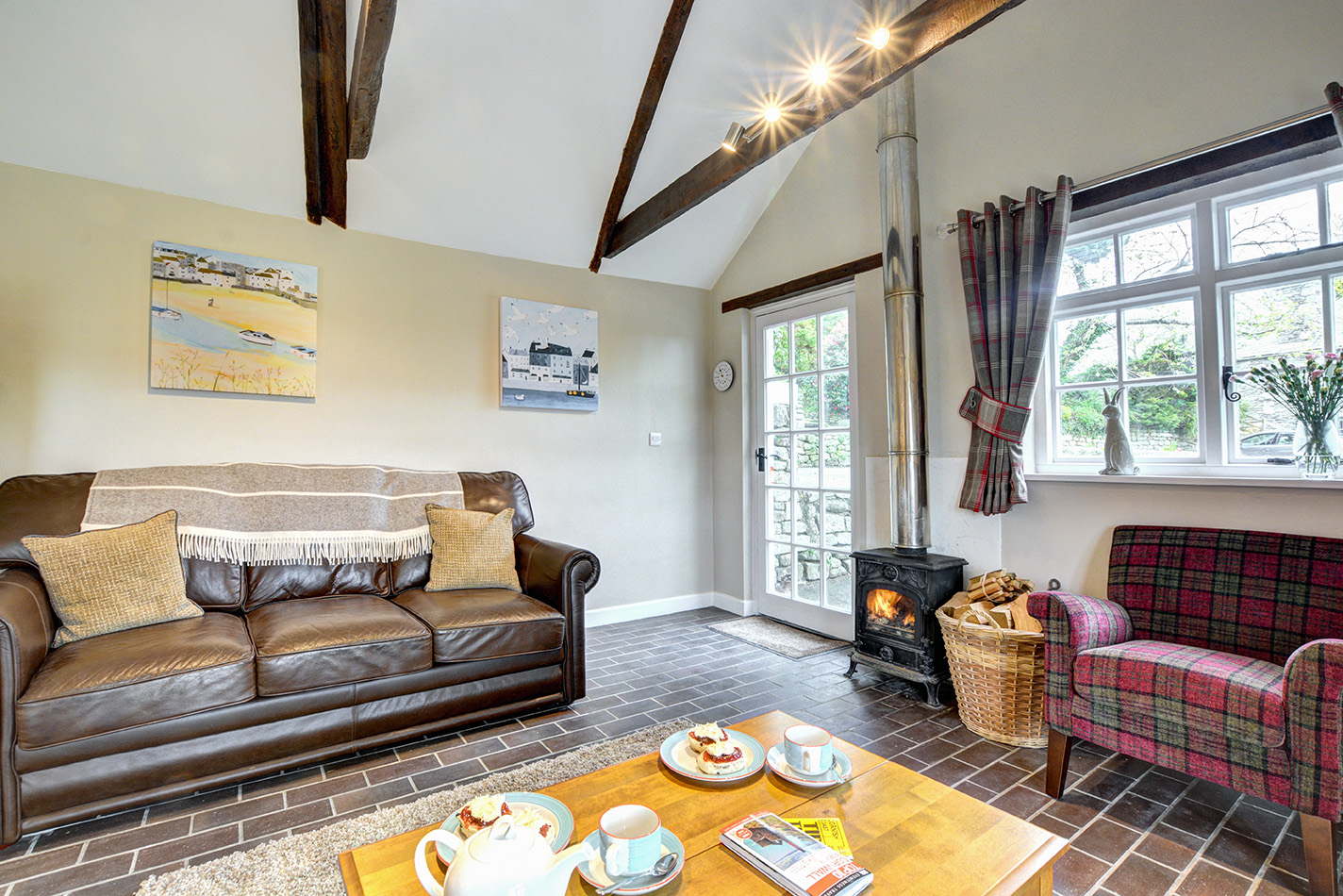 The lounge area of The Linney self catering cottage converted barn at Penrose Burden holiday cottages in Cornwall.jpg