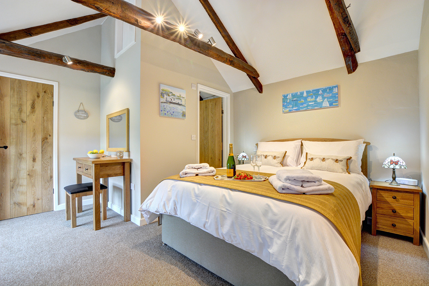 The bedroom of The Linney self catering cottage converted barn at Penrose Burden holiday cottages in Cornwall 01.jpg