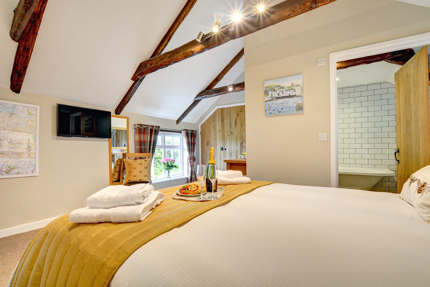 The bedroom of The Linney self catering cottage converted barn at Penrose Burden holiday cottages in Cornwall 03.jpg