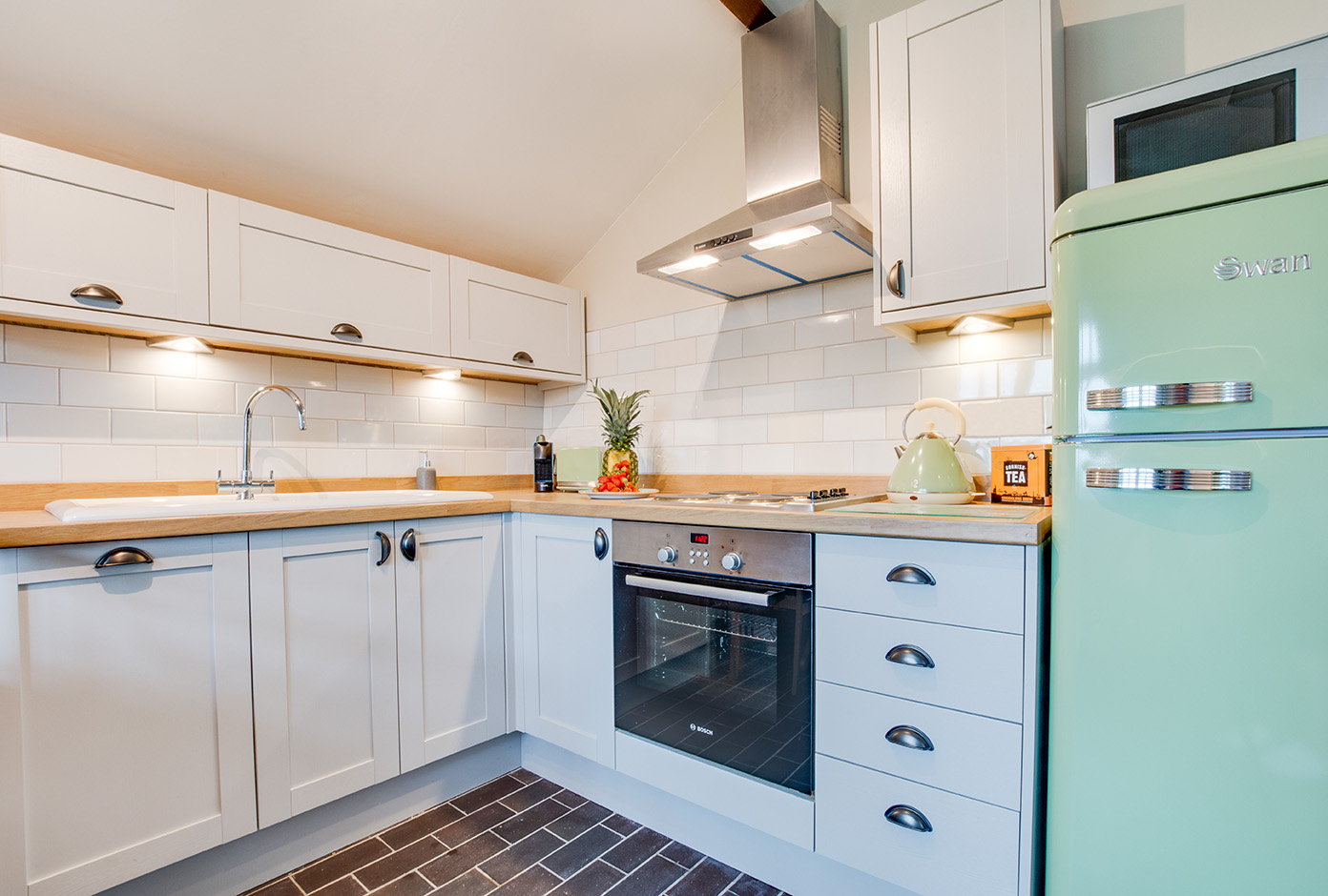 The kitchen area of Snappers luxury self catering converted barn holiday cottage at Penrose Burden in North Cornwall 02.jpg