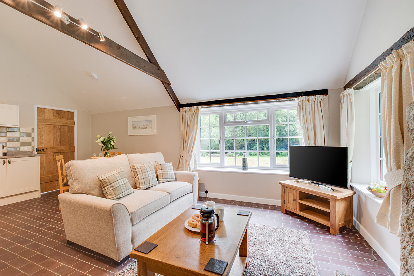 The lounge area of Troutstream luxury self catering converted barn holiday cottage at Penrose Burden in North Cornwall 02.jpg