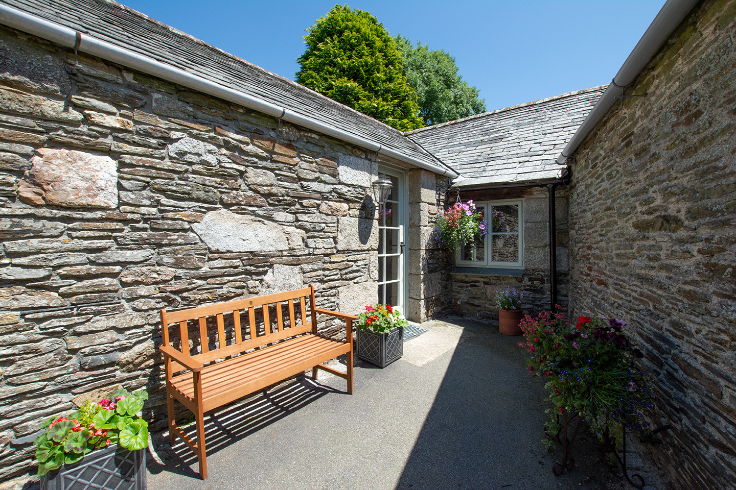 The exterior of Goosehill luxury self catering converted barn holiday cottage at Penrose Burden in North Cornwall 01.jpg