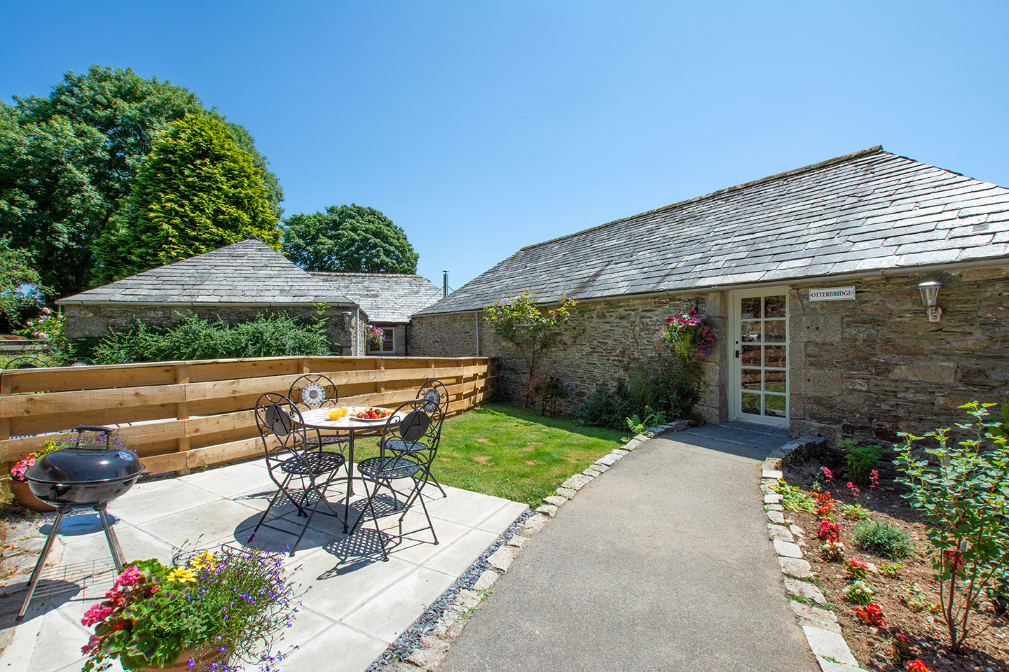 The exterior of Otterbridge luxury self catering converted barn holiday cottage at Penrose Burden in North Cornwall 01.jpg
