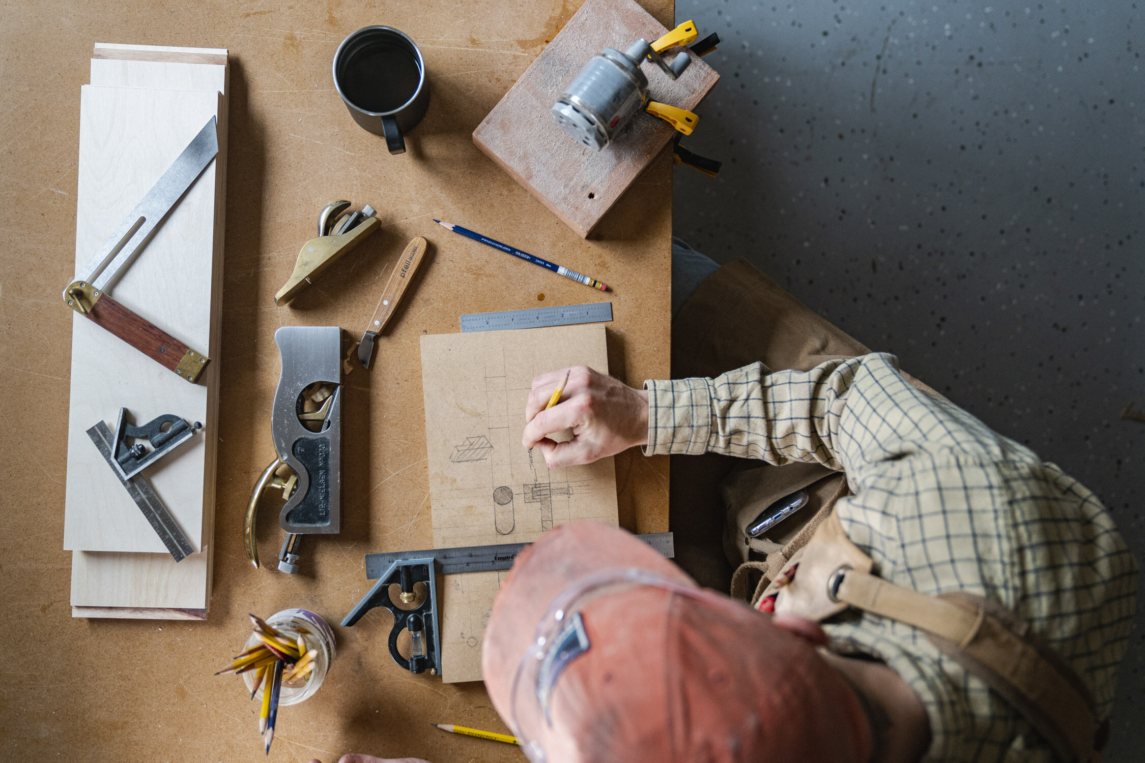 Environmental Portrait of Casey Chandler designing a wooden latch in Santa Cruz, CA