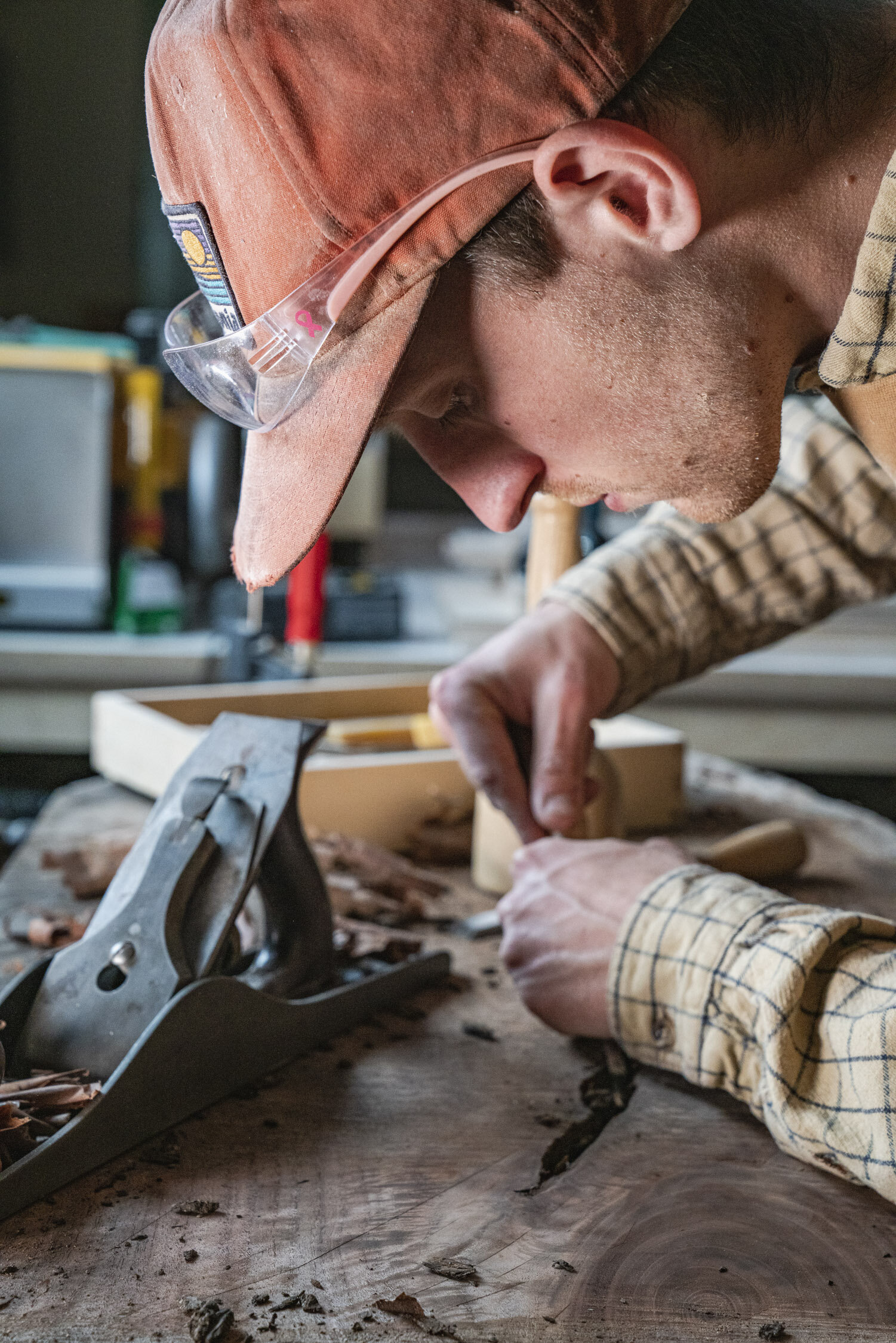 Environmental Portrait of Casey Chandler designing a wooden latch in Santa Cruz, CA