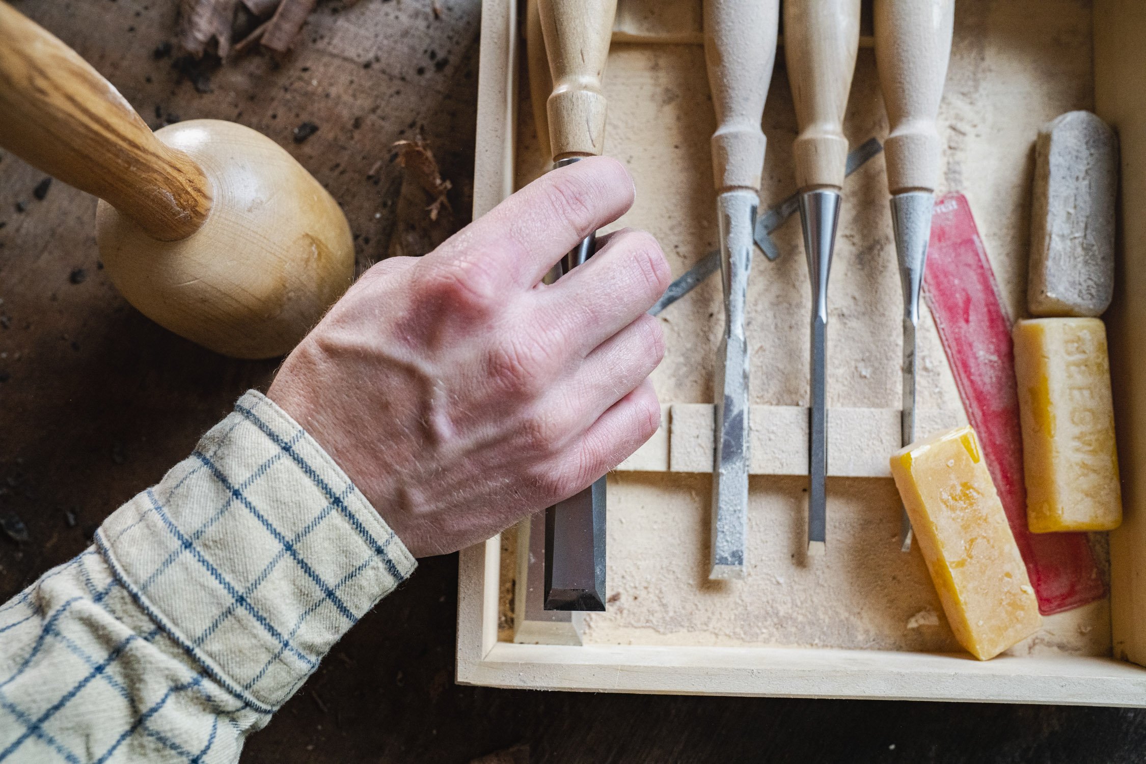 Environmental Portrait of Casey Chandler designing a wooden latch in Santa Cruz, CA