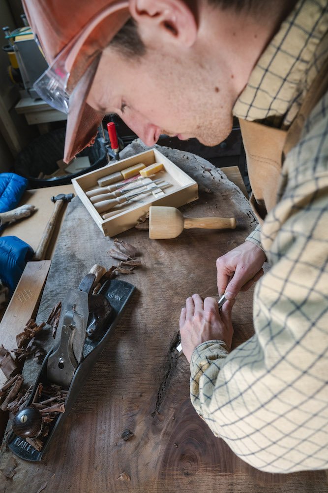 Environmental Portrait of Casey Chandler designing a wooden latch in Santa Cruz, CA