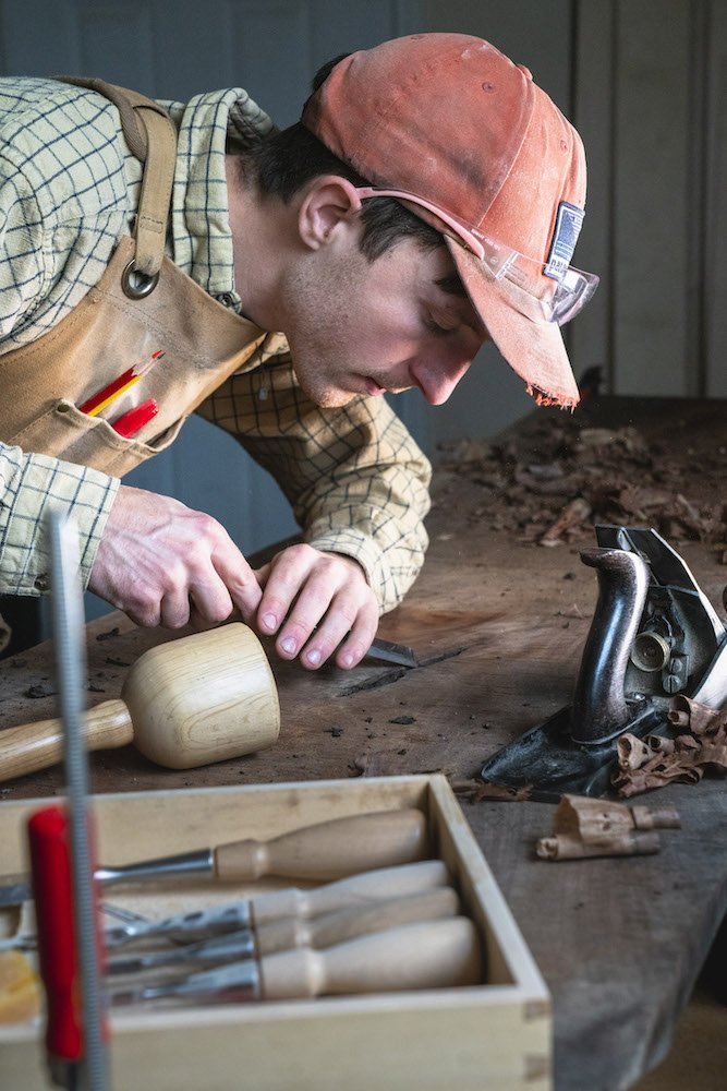 Environmental Portrait of Casey Chandler designing a wooden latch in Santa Cruz, CA