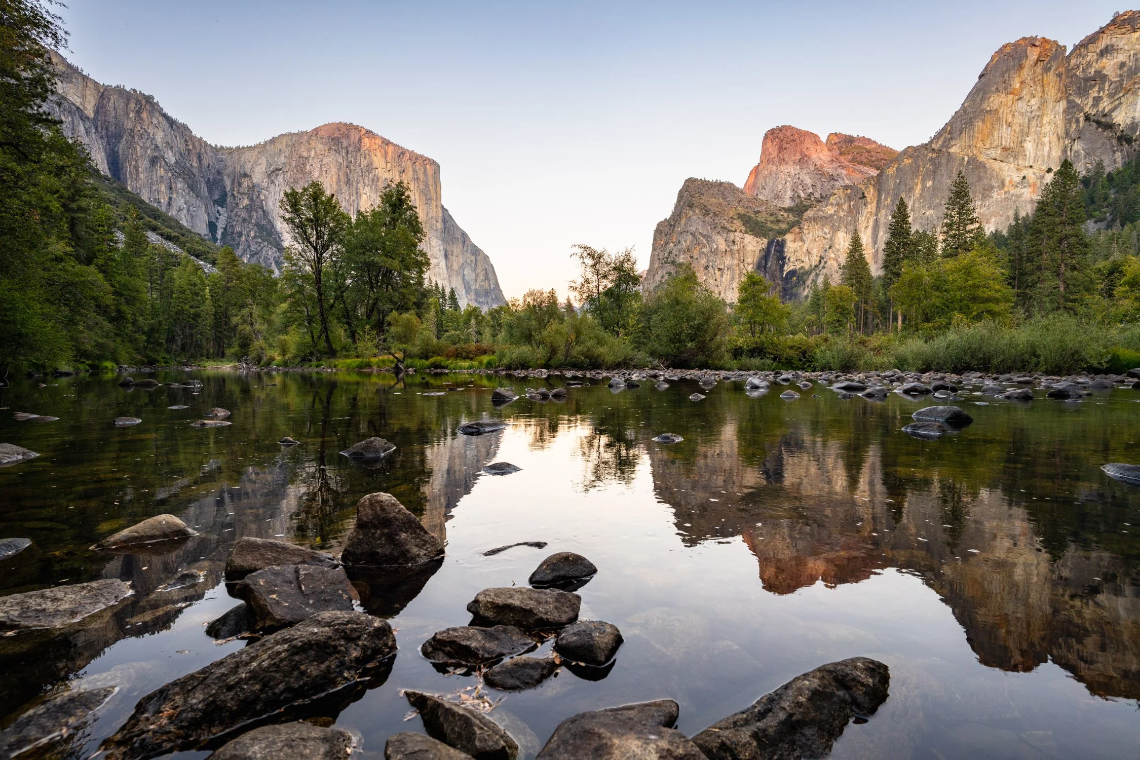 Adventure photographer Dalton Johnson photographs hanging valley view in Yosemite Valley at sunrise on a fall day in California