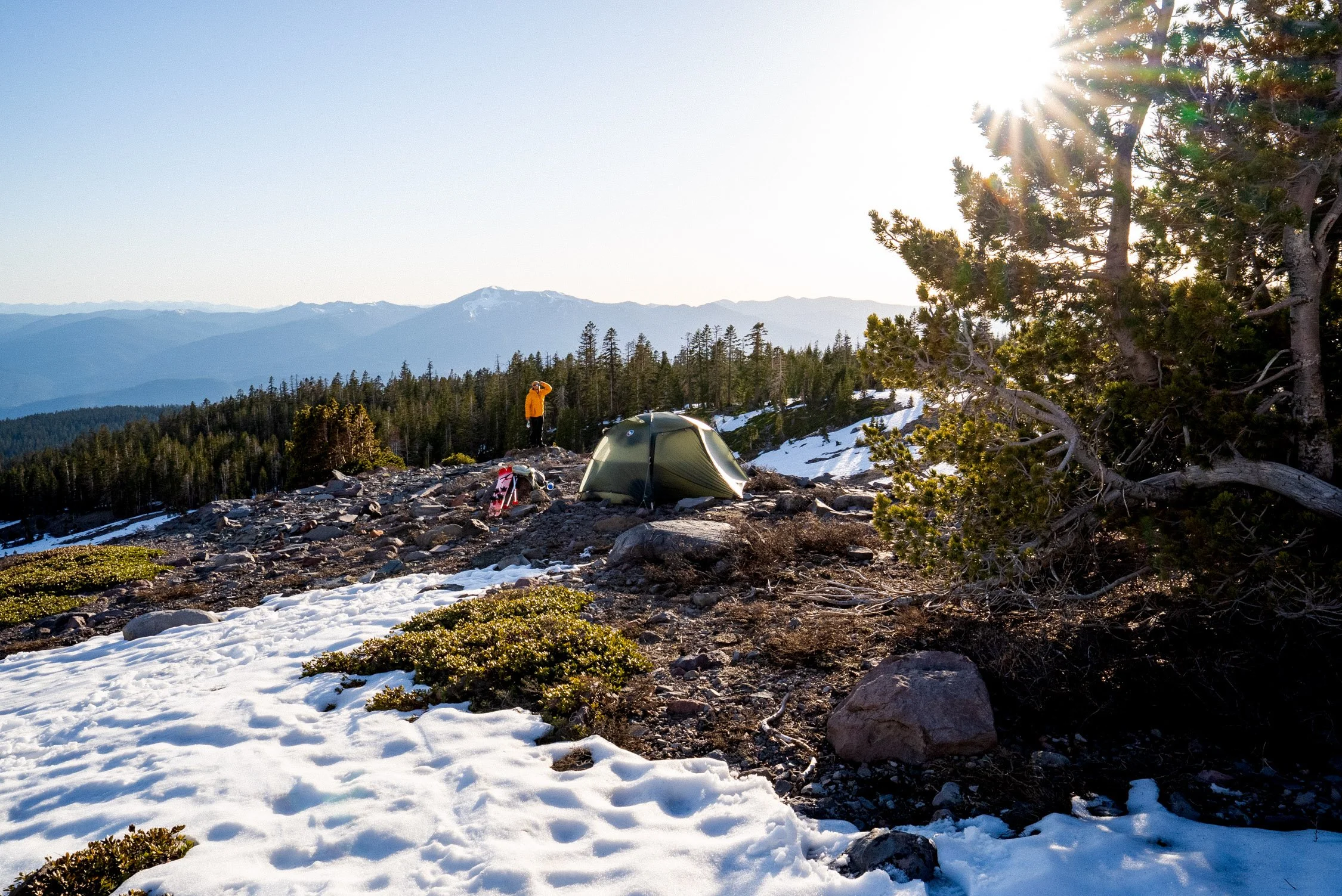 adventure photographer Dalton Johnson photographs a tent on mountain in Northern California