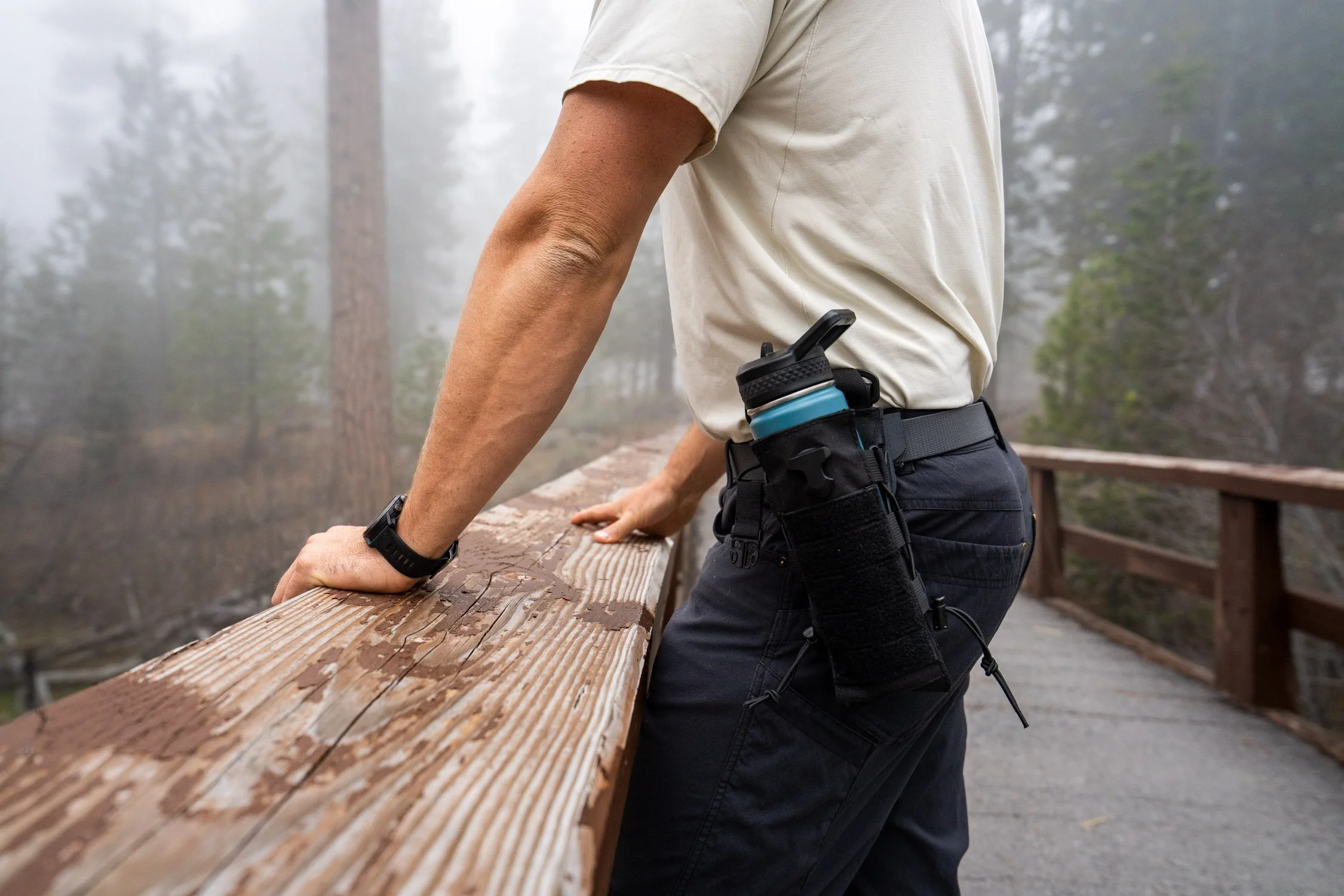  Adventure photographer, Dalton Johnson, photographs a product photograph of a water bottle on a belt. 