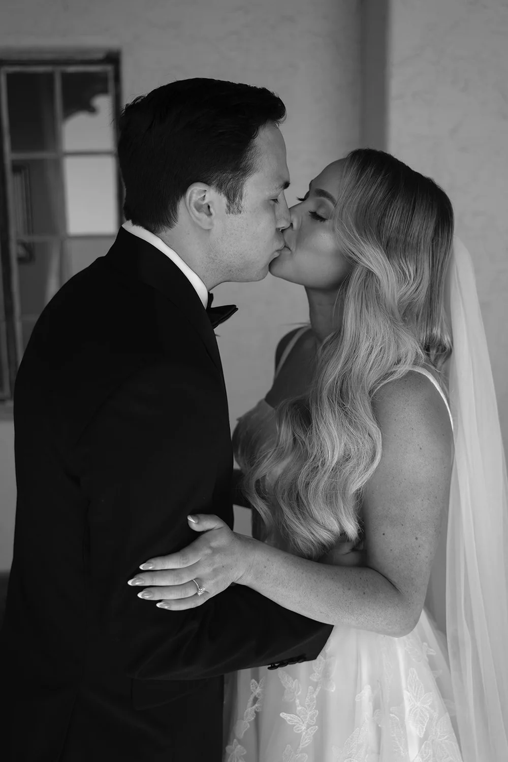 Black and white photo of Berkeley kissing Jane