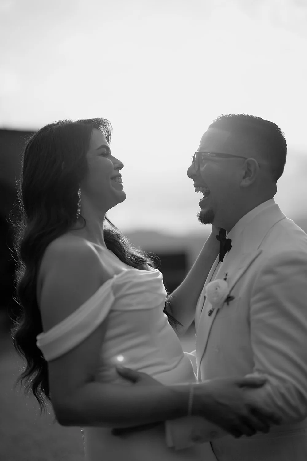 Black and white photo of Krystine and Douglas laughing together