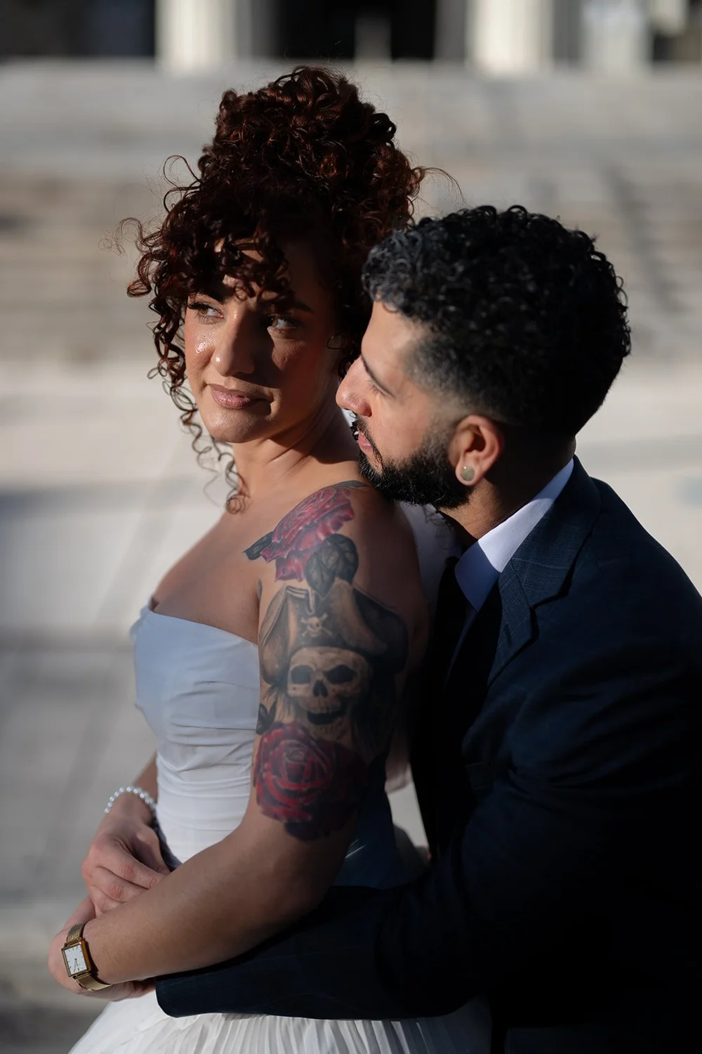 Bride and groom embracing in afternoon sun in downtown Miami