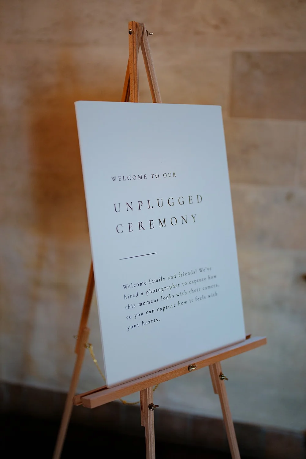 A sign on an easel that reads Unplugged Ceremony