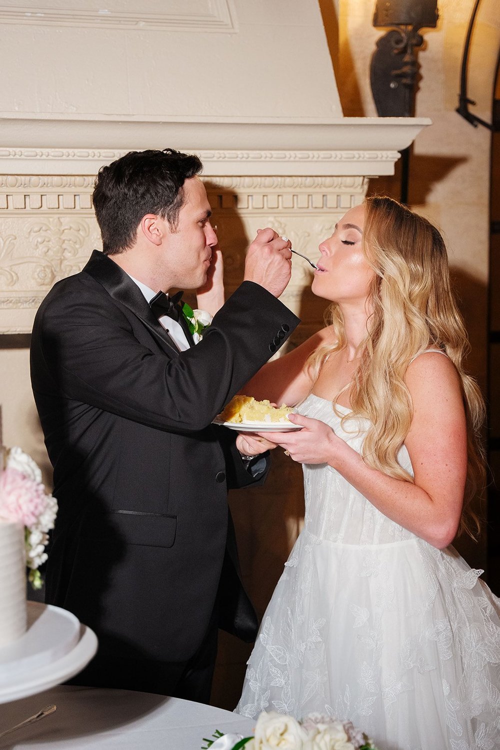 Berkeley feeding Jane a bite of wedding cake