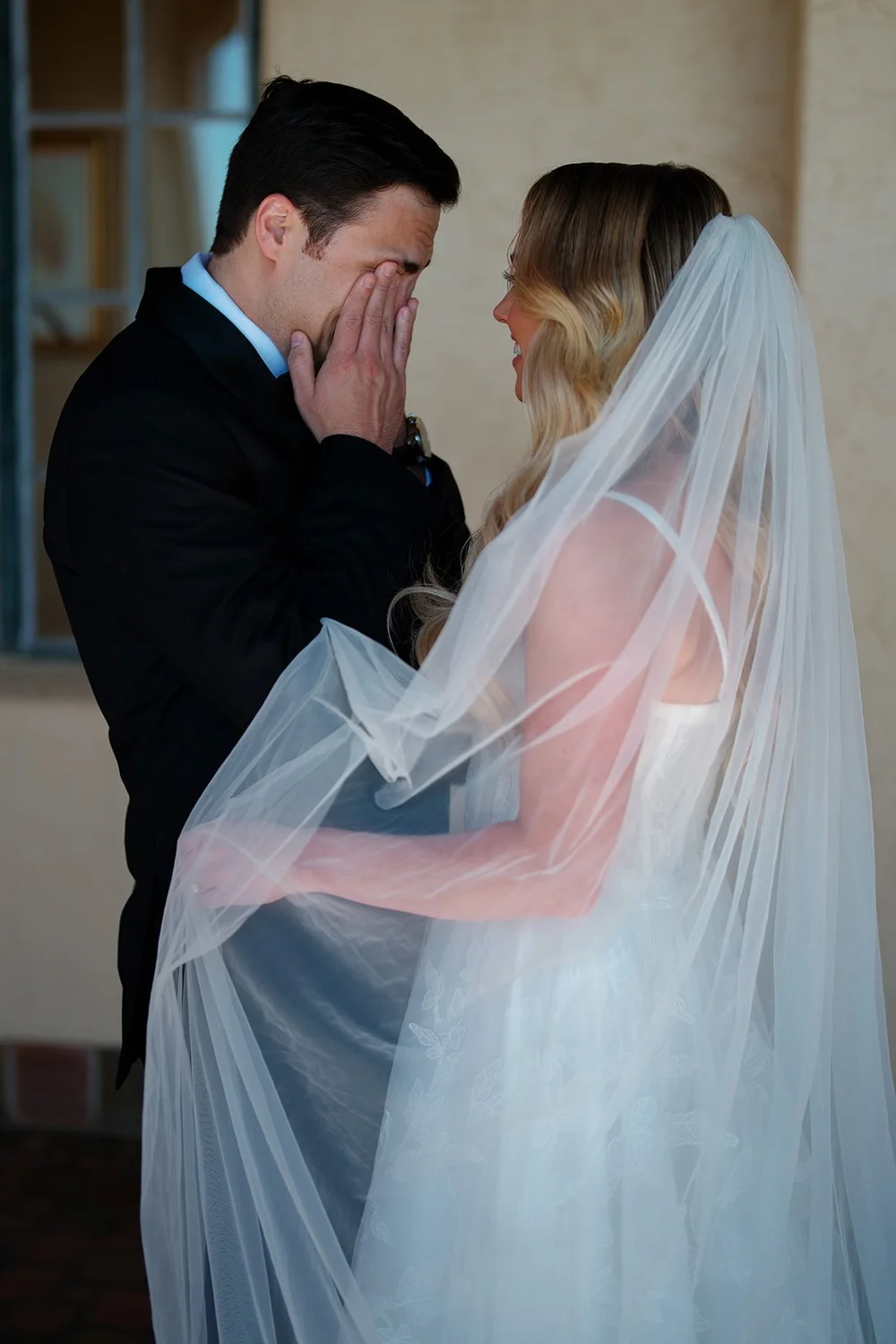 Berkeley wiping his eyes as Jane stands in front of him in her veil
