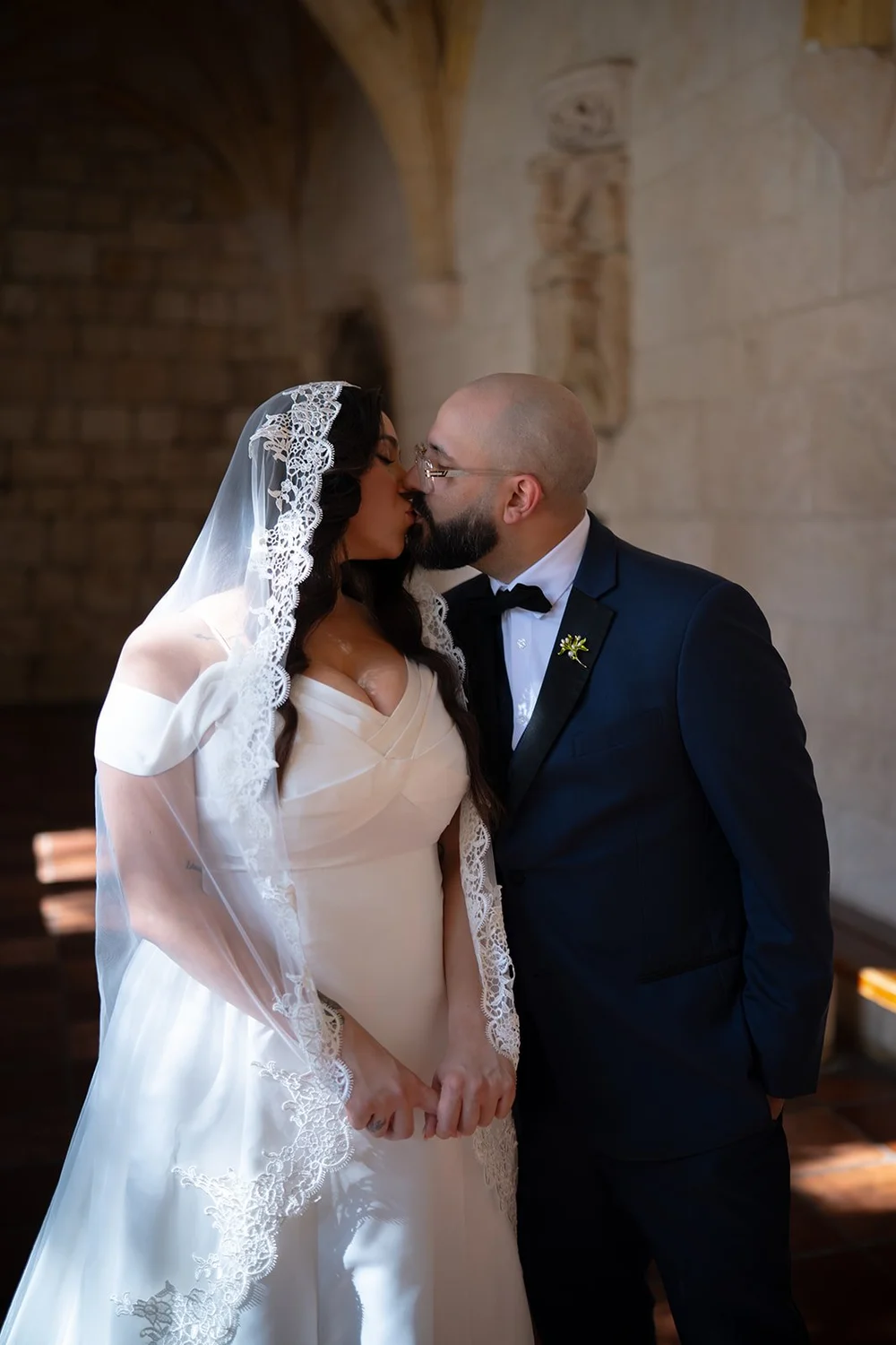 Maria and Christian standing close as Christian kisses her cheek