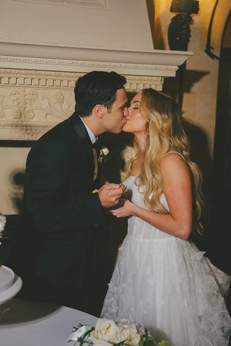 Film photo of Berkeley kissing Jane at the reception