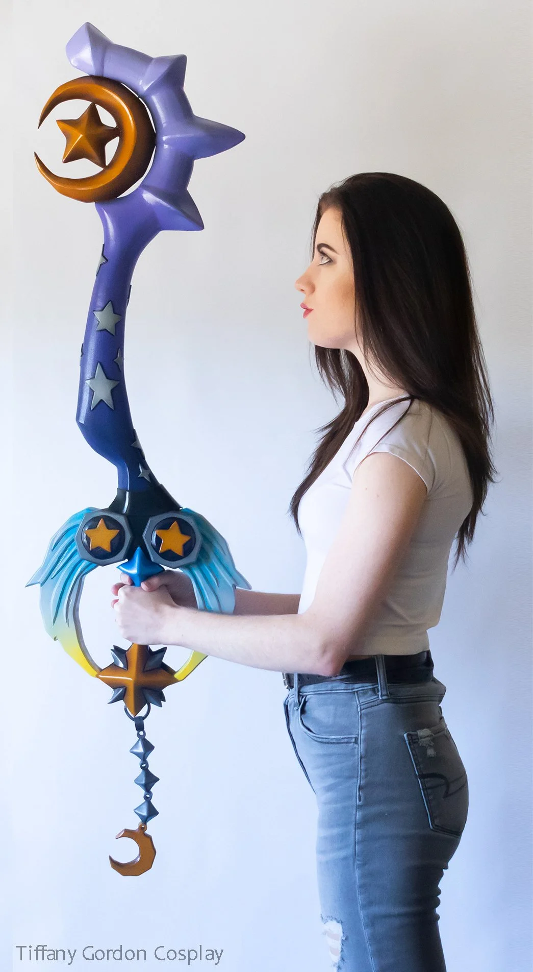 Life-size Star Seeker Keyblade prop from Kingdom Hearts by Tiffany Gordon Cosplay, showing the vertical scale and detailed star and moon motifs.