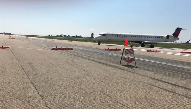 A Delta jet navigates the airfield at CIRA during phase one pavement resurfacing work last year. (Image Credit: Central Illinois Regional Airport)