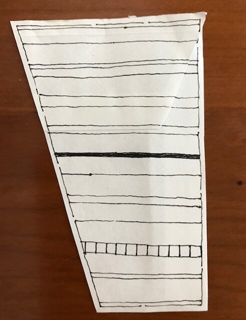  Using one section, draw a series of perpendicular lines evenly spaced creating a row of squares.  