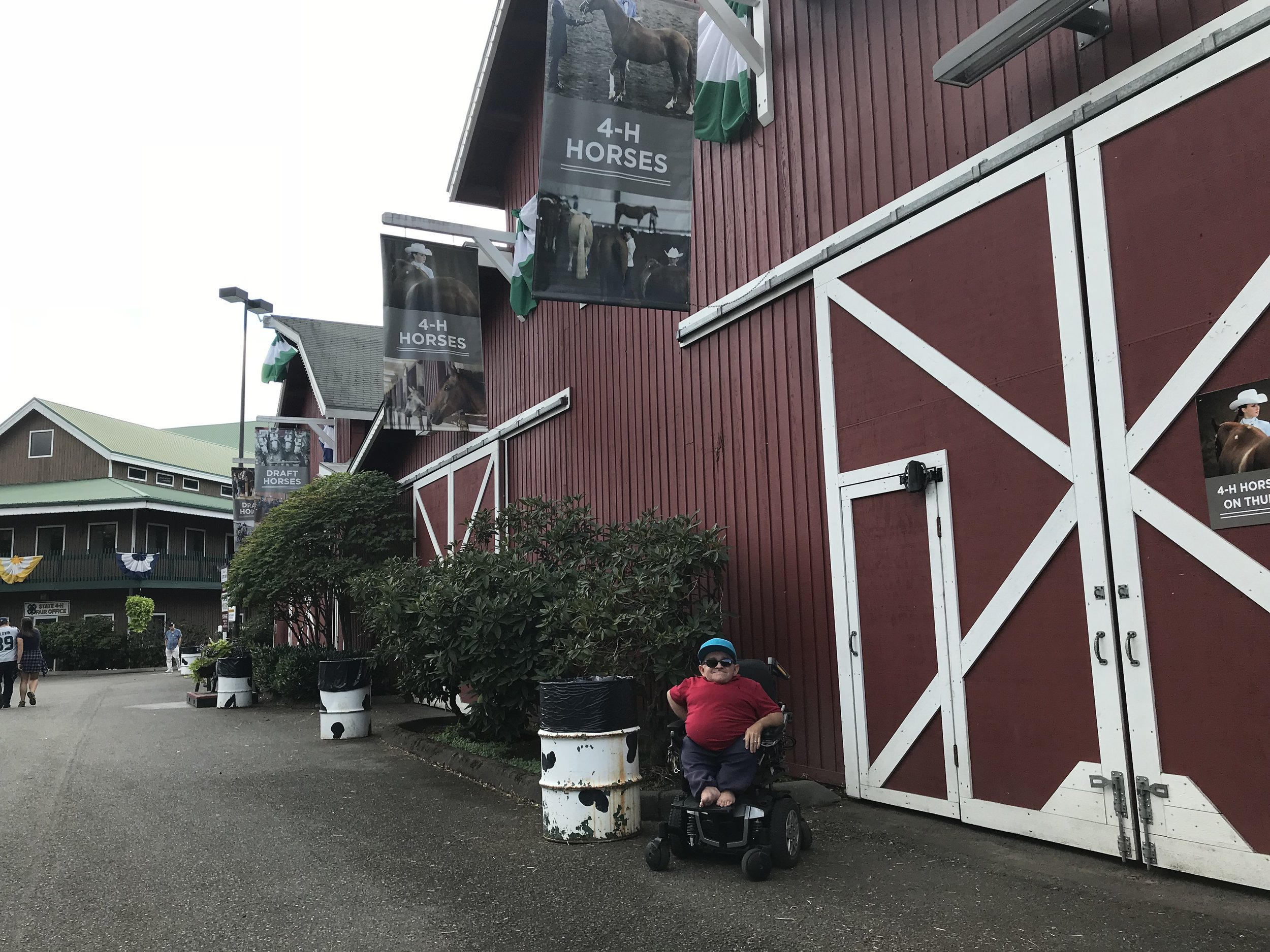 Drew in front of one of the several 4-H Horse Barns.