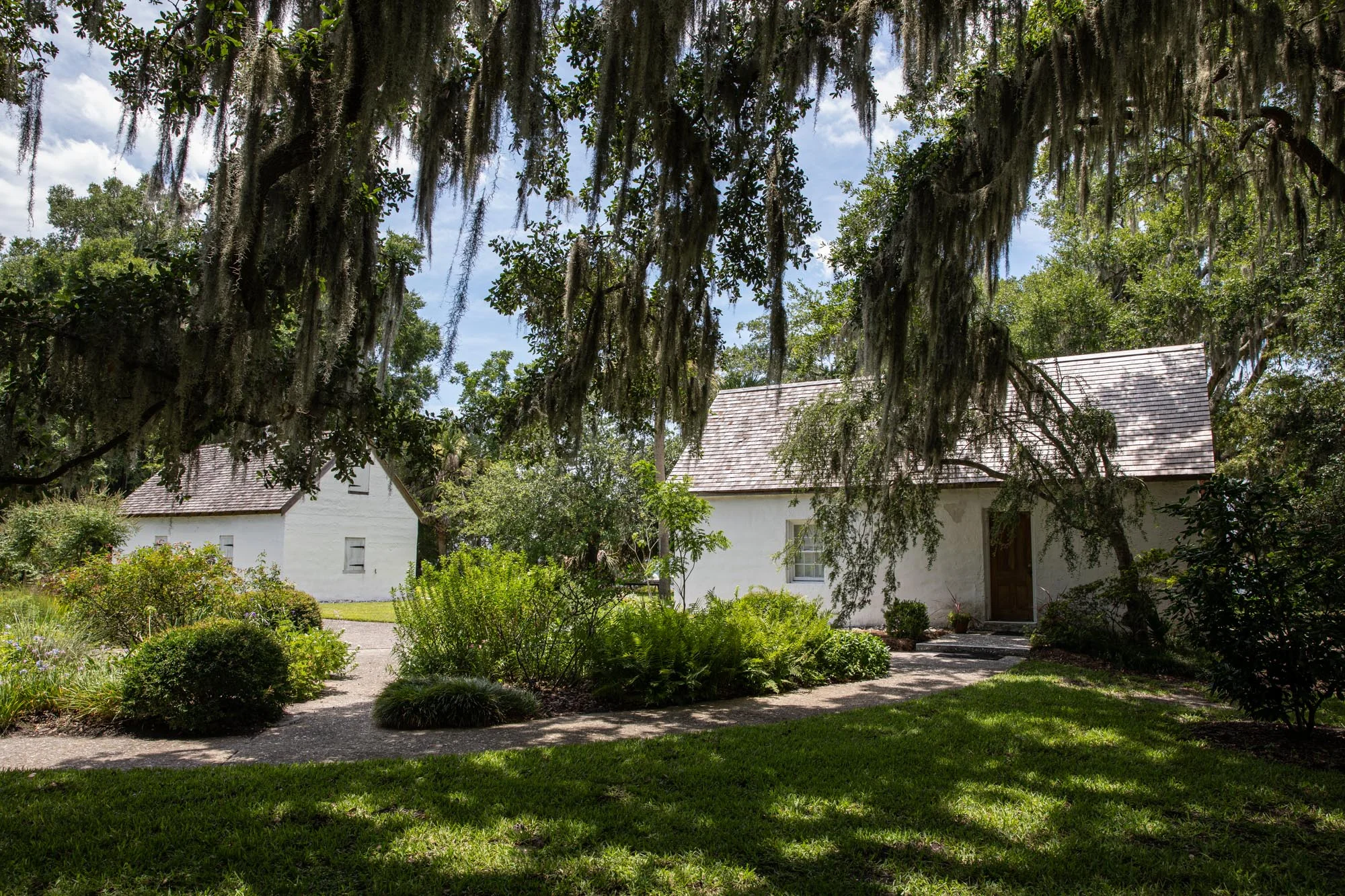 Hamilton Plantation slave cabins now used by the Casino Garden Club for their flower garden.