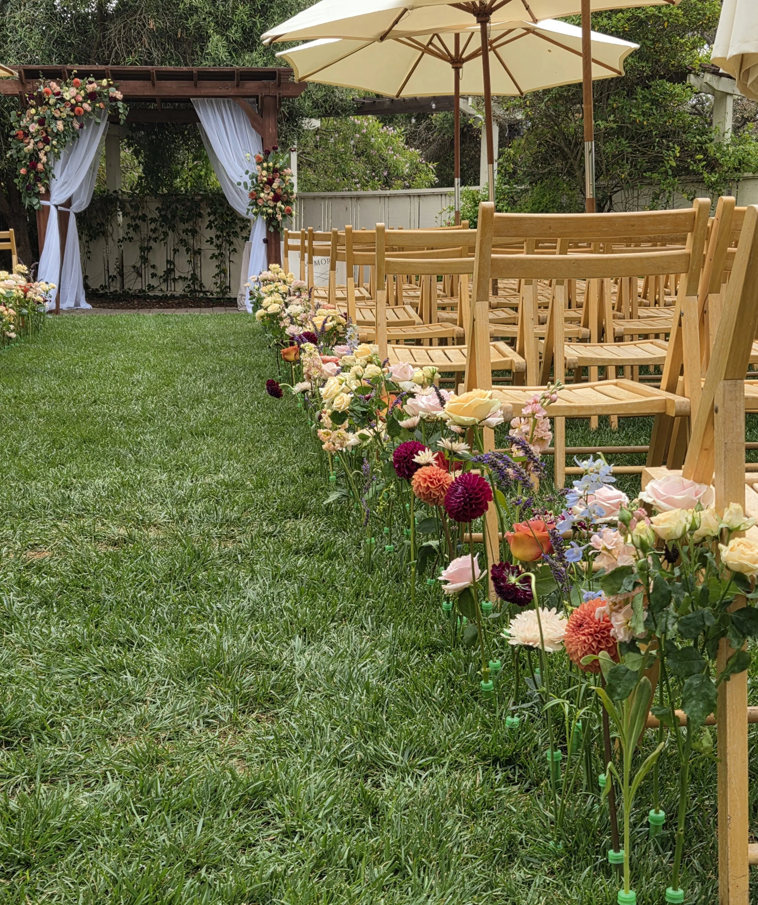 20260626 Ceremony aisle arch ground stem flying cloud.jpg