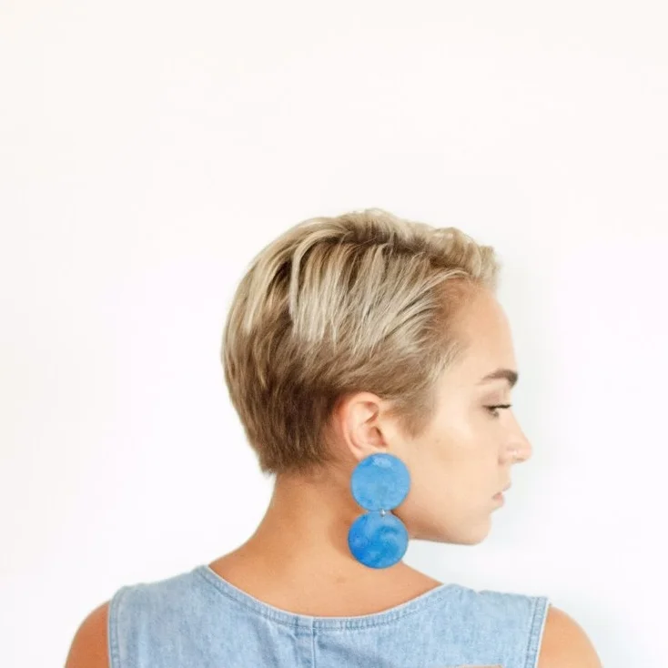 made by hand in new orleans, LA with brass, patina cobalt blue, swinging circle earrings available in at Wares in Beacon NY and to shop online now