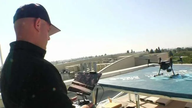 A Chula Vista Police Department officer on the roof of police headquarters where drones launch