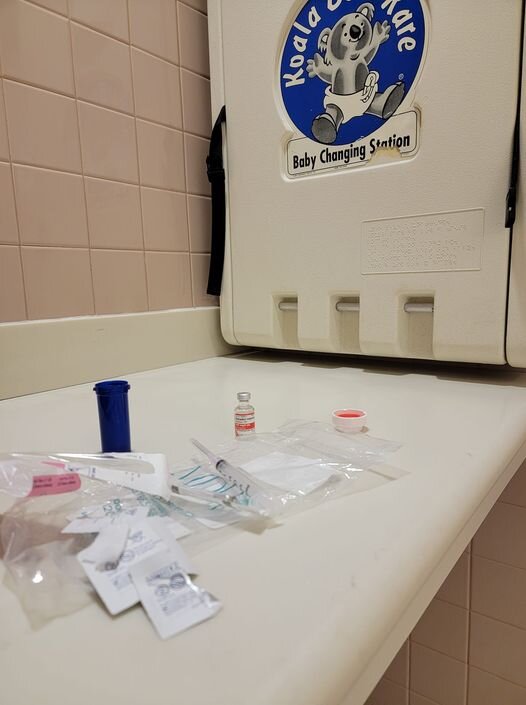 Shots in an airport bathroom….