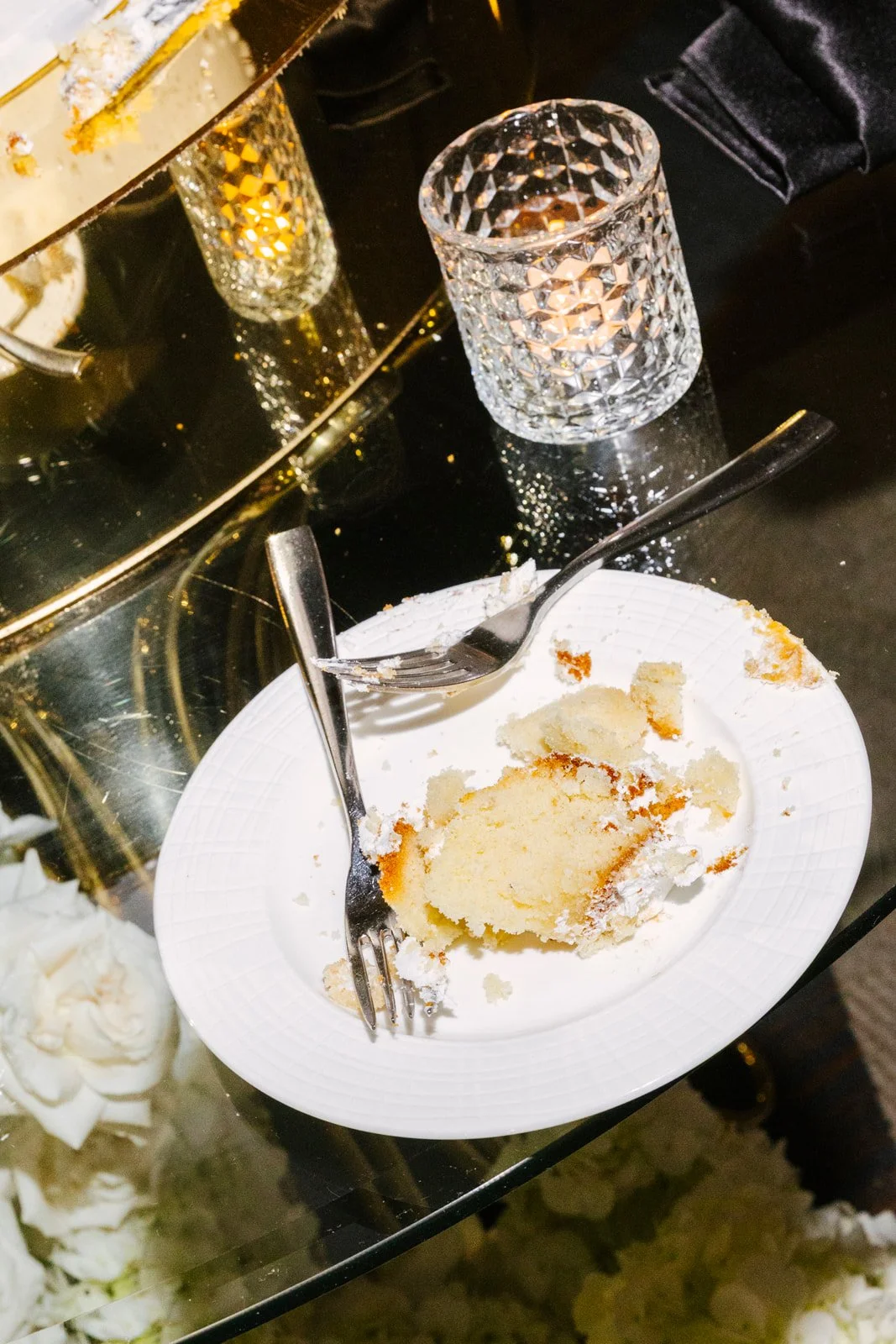 Wedding rings and champagne details arranged together, photographed by Topflash Photography