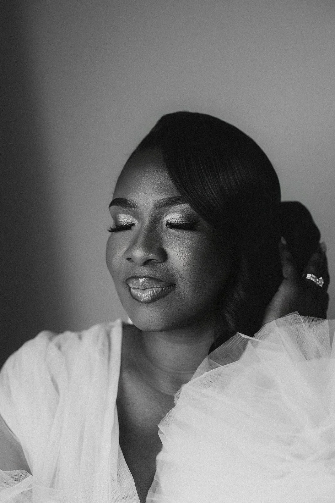 Black and white portrait of a bride getting ready, photographed by Topflash Photography