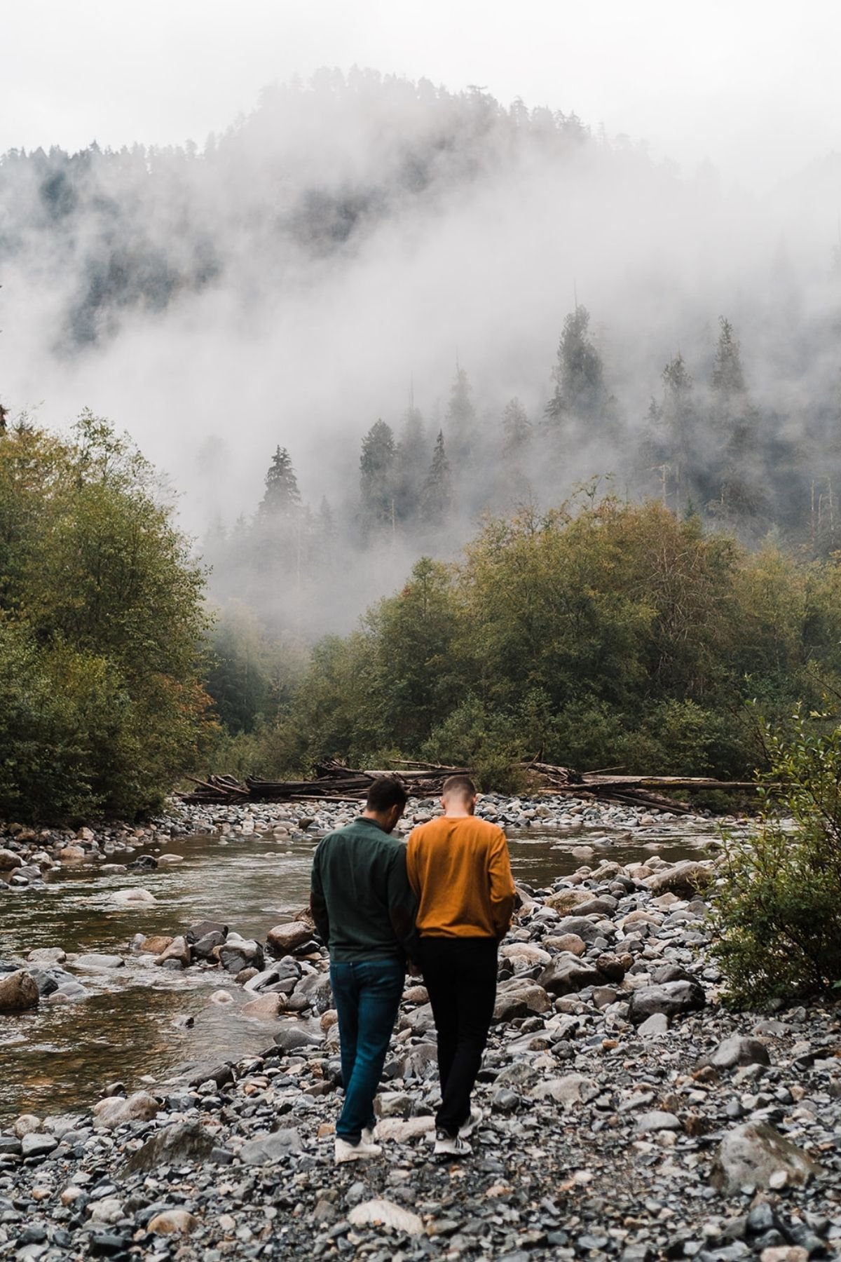Rainy Engagement Photos in the Forest | Between the Pine