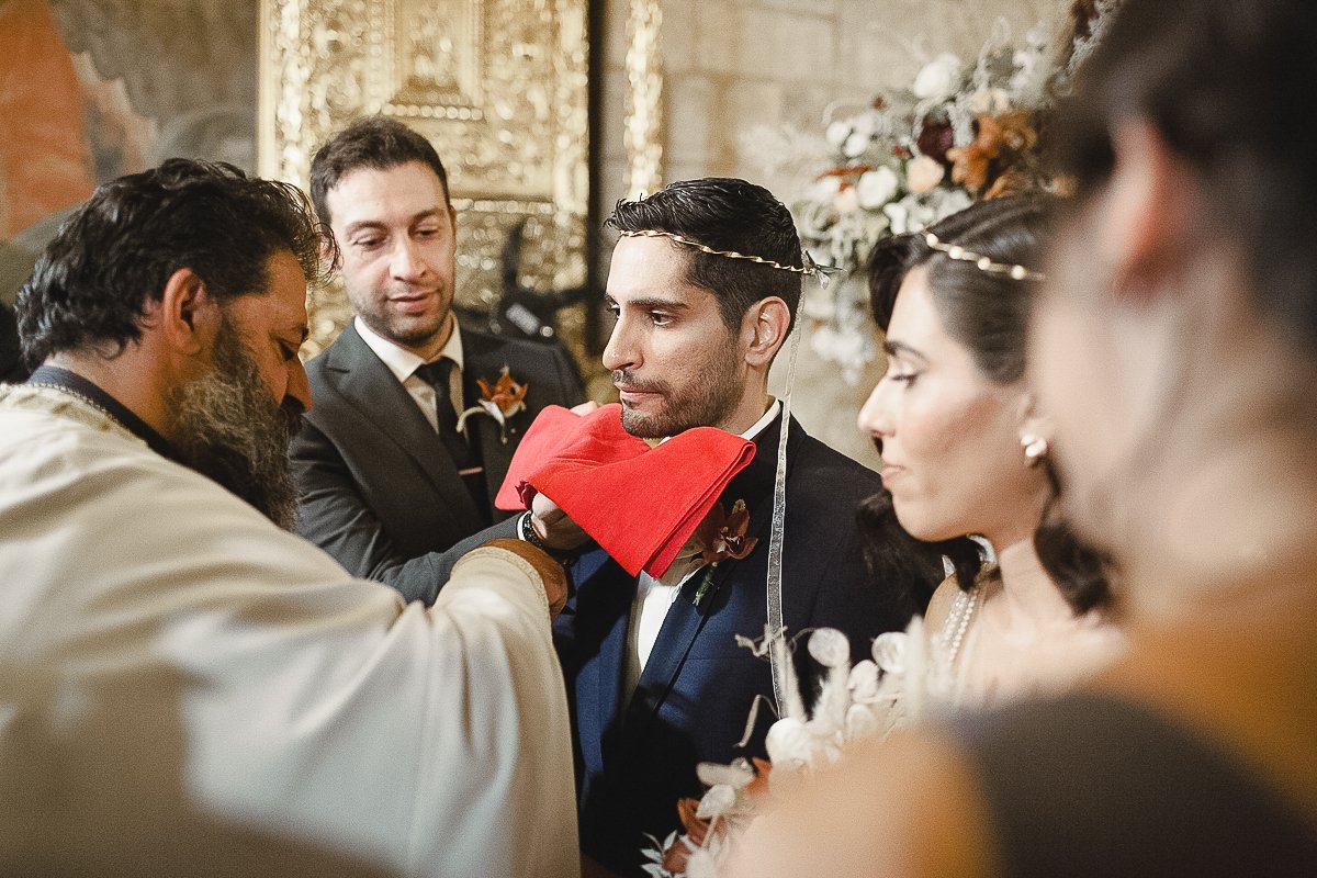 Marios taking holy communion at his wedding in archaggelou michael church nicosia