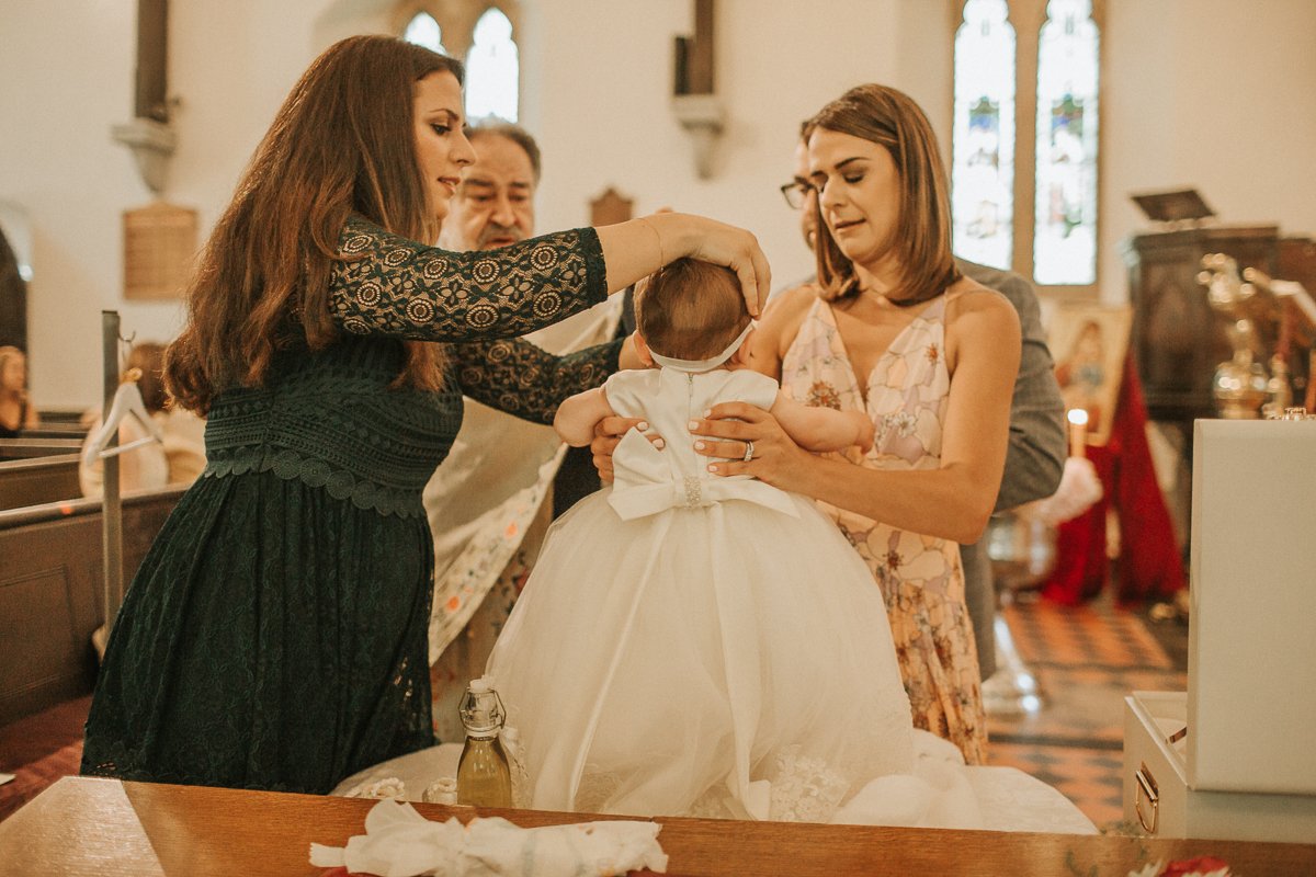 Christening baby girl in St Katherine's Church in Barnet, North London