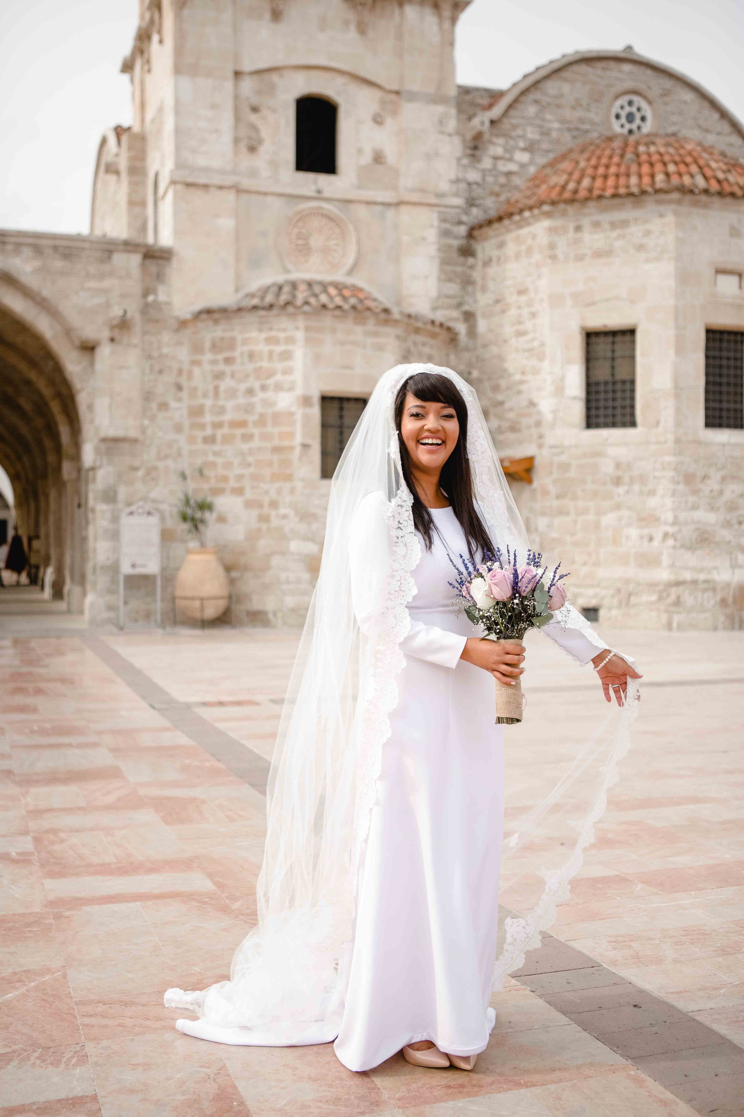 Bride Tammi posing outside St Lazarus Church, Larnaca