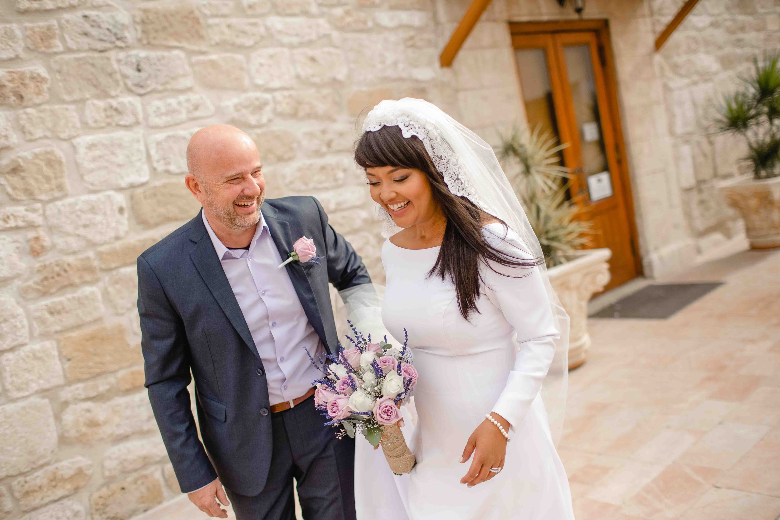 Bride Tammi and groom Demi posing outside St Lazarus Church, Larnaca