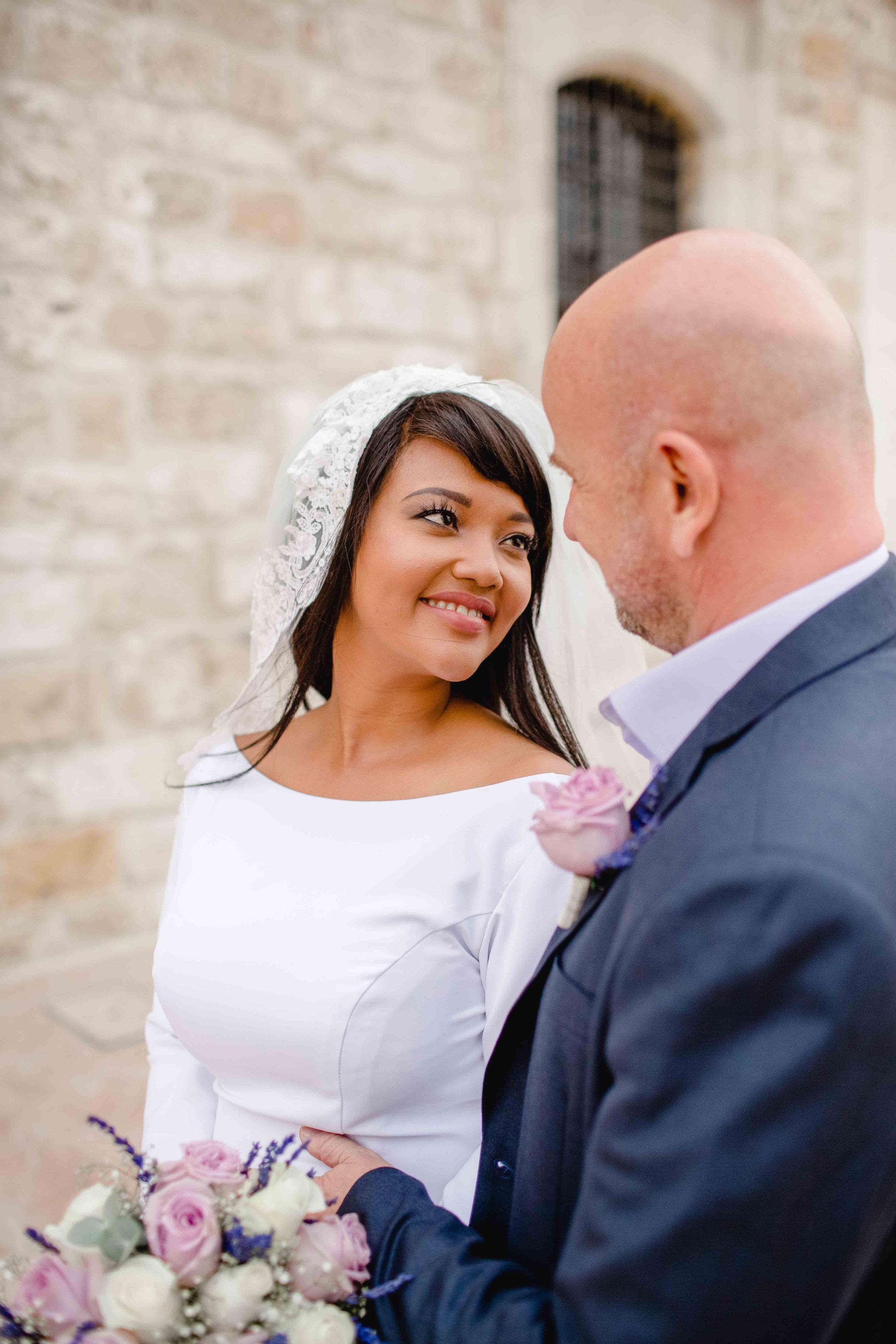 Bride Tammi and groom Demi posing outside St Lazarus Church, Larnaca