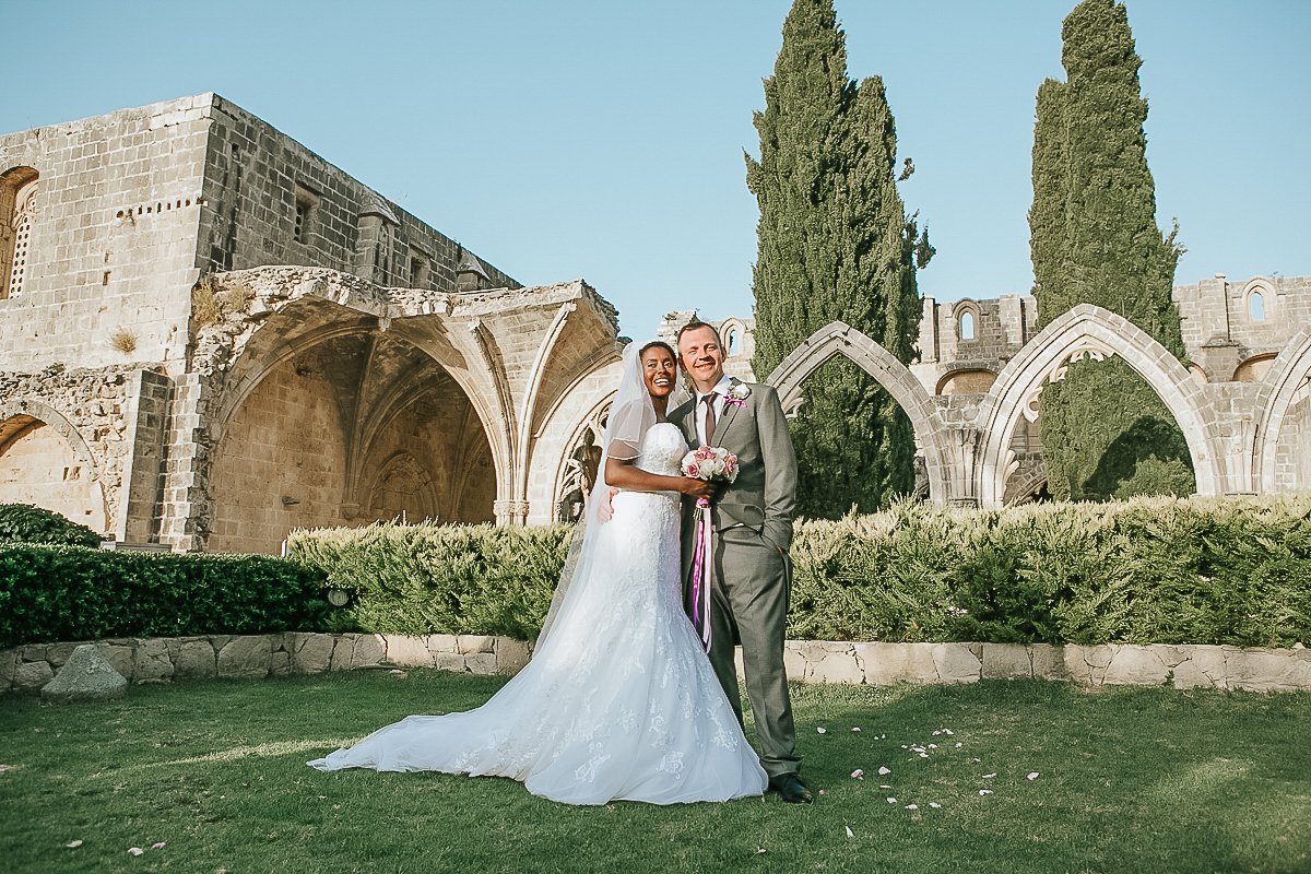 Wedding photograph of married couple outside Bellapais Abbey in Cyprus