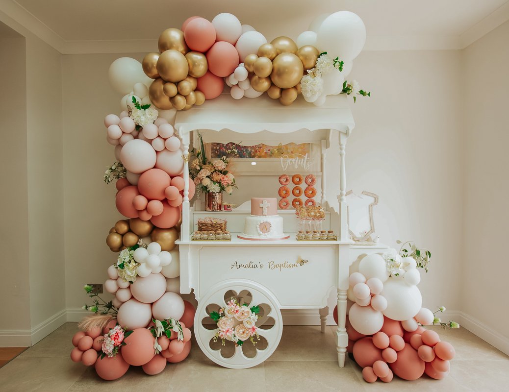 Candy table christening cart decorated with balloons