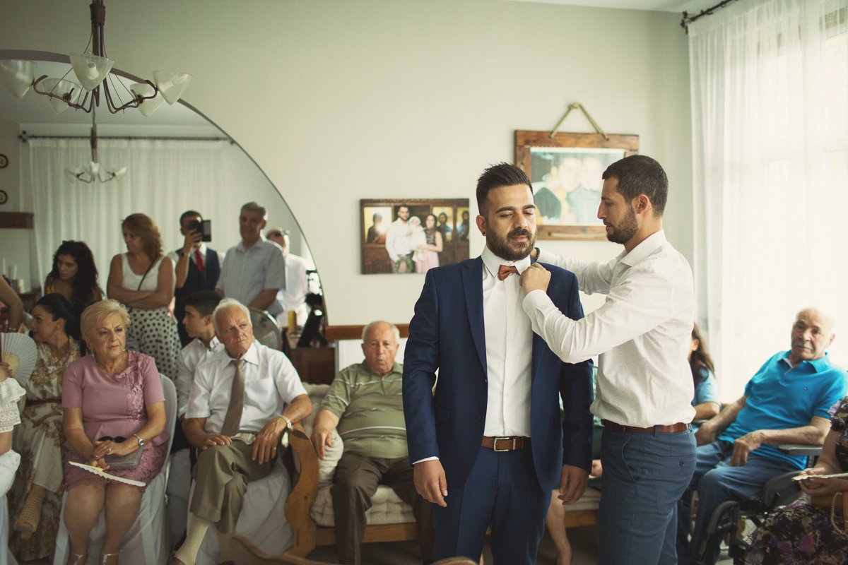 Andreas getting dressed by best man at stolisma.