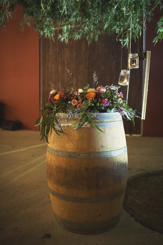 Flowers decorating the barrel tables at aes ambelis winery.