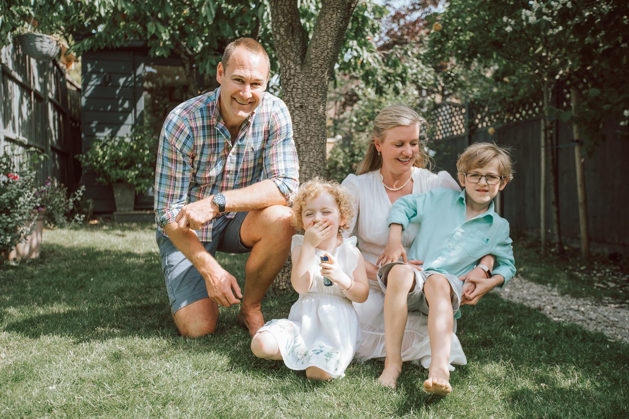 Joy-Anne and family and husband sitting in their garden in Tooting.