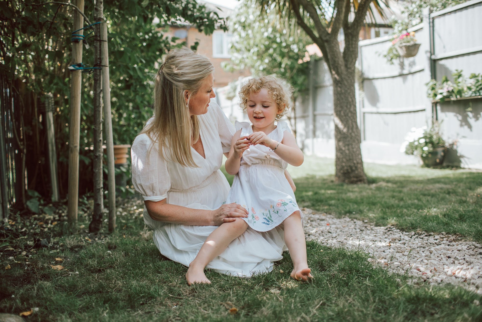 Jot-Anne and her daughter sitting in their garden.