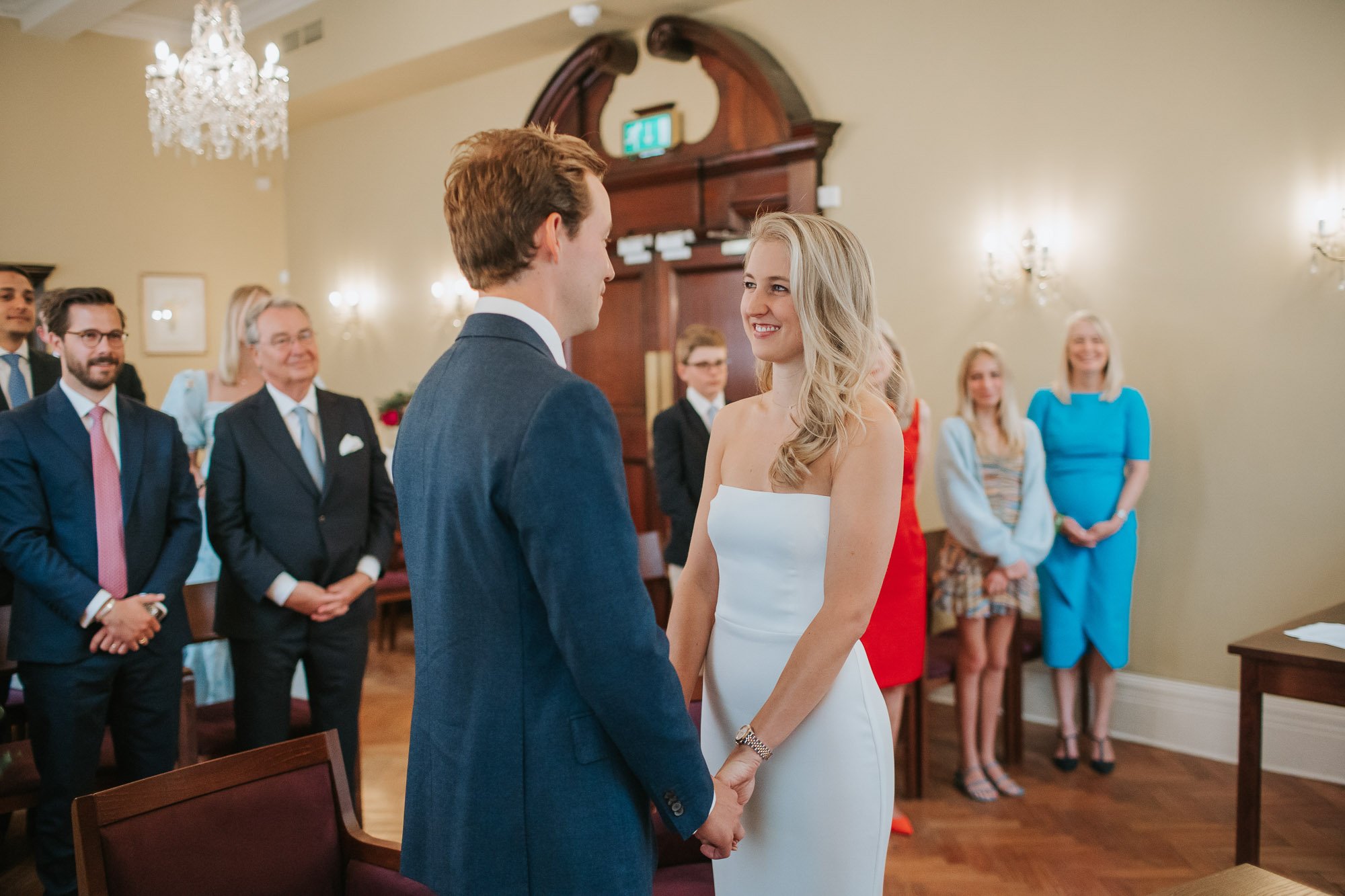 Bride and groom exchanging vows at chelsea old town hall.