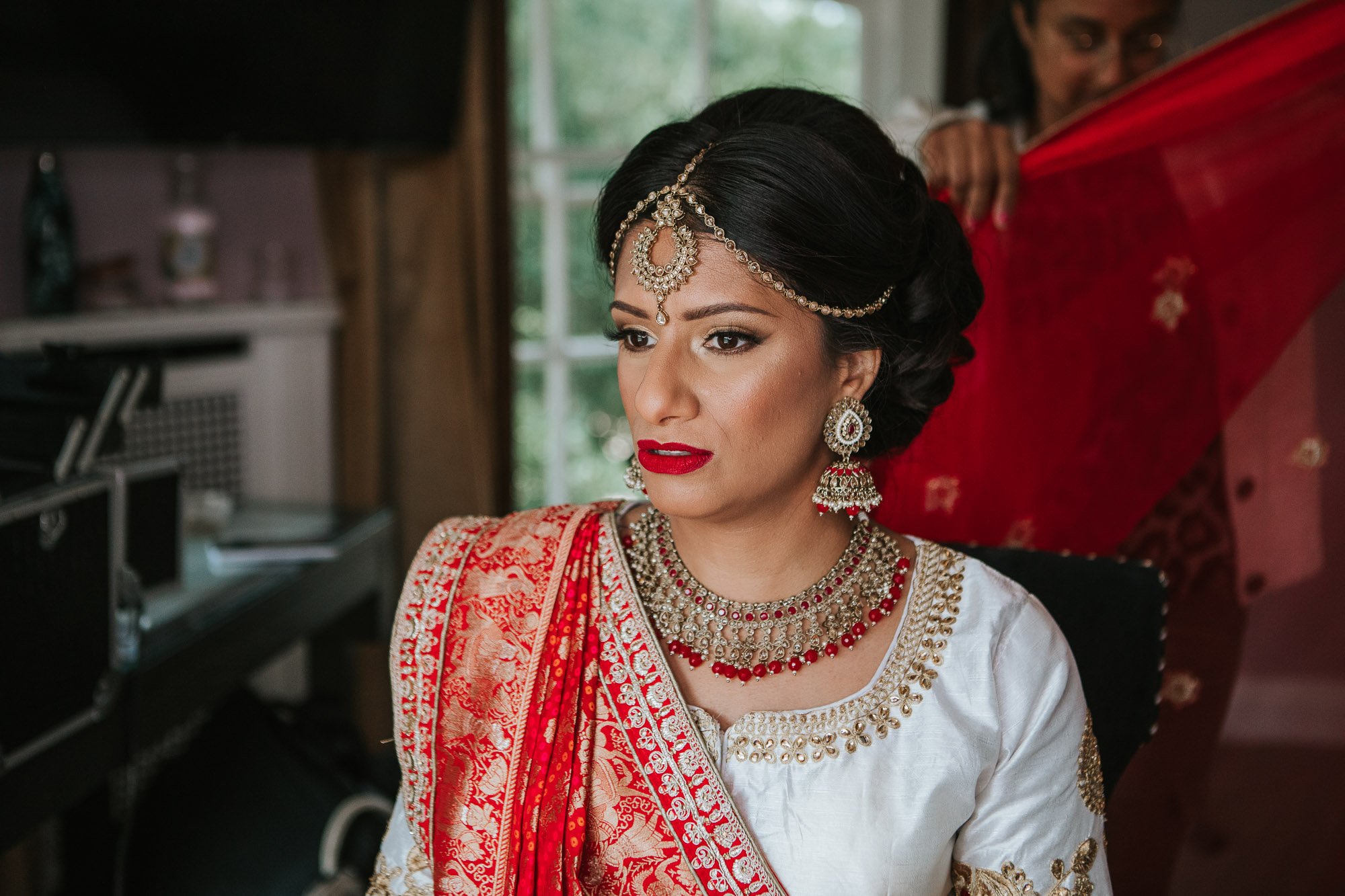Hindu Bride dressed in traditional red sari.