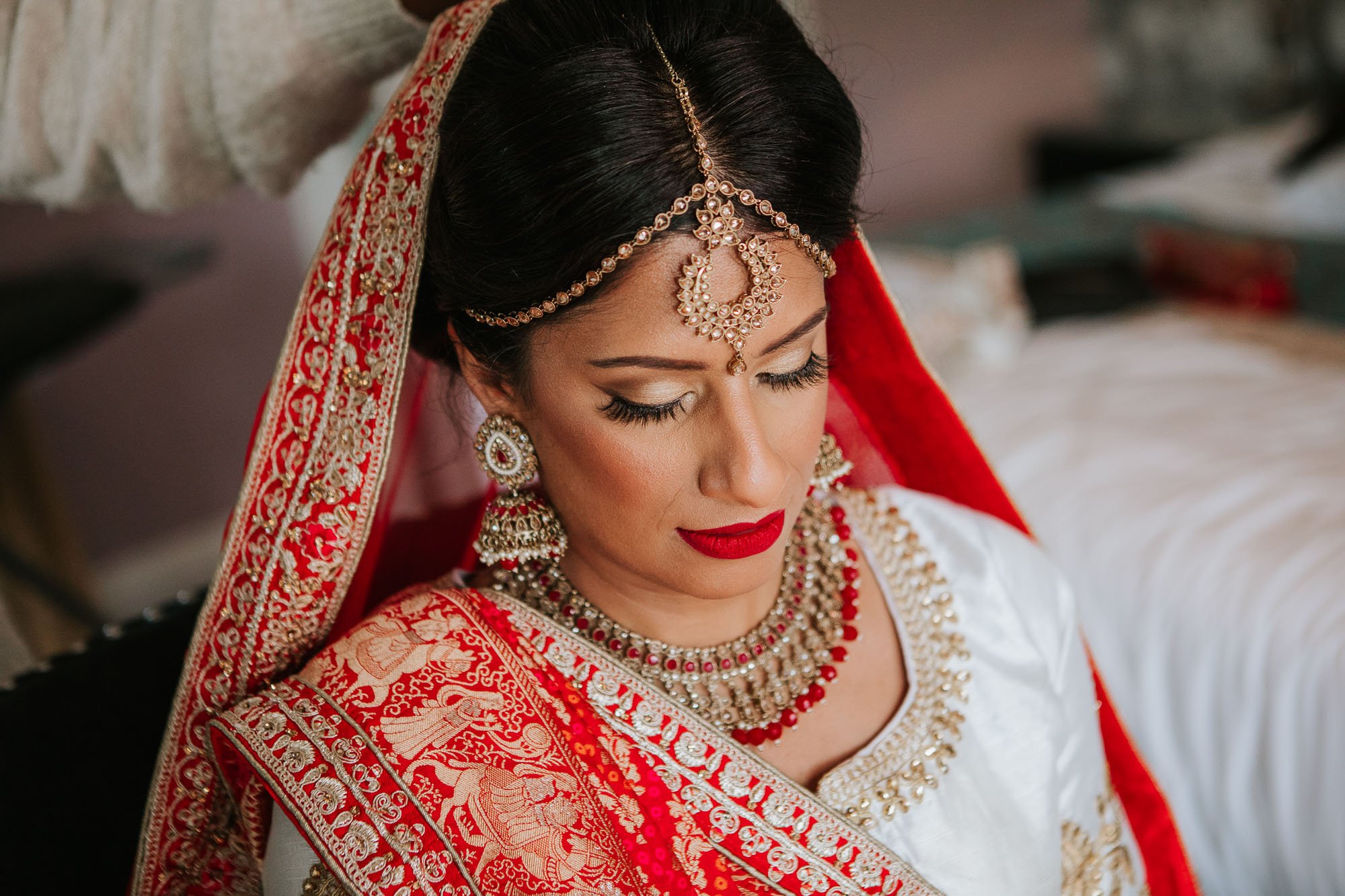 Hindu Bride dressed in traditional red sari.