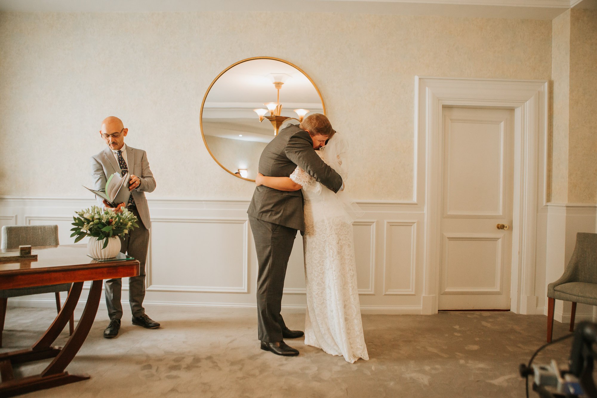  Bride and Groom embrace after marrying at Wandsworth town hall in Wandsworth, South London. 